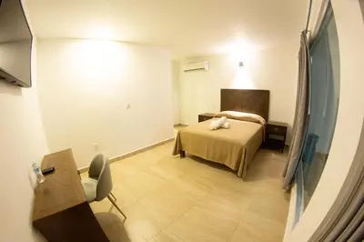 Cama o camas de una habitación en HOTEL REFORMA 14