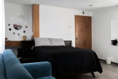 Cama o camas de una habitación en Casa las Maravillas, hermosos jardines y alberca