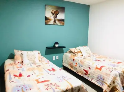 Cama o camas de una habitación en Tu refugio en CDMX cerca del Foro Sol y del AICM
