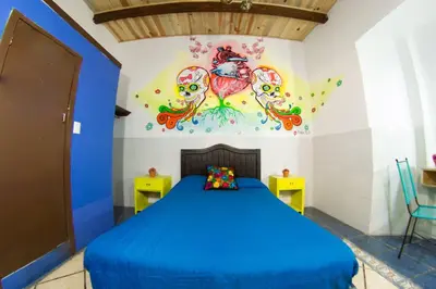 Cama o camas de una habitación en Gente de Más Hostel