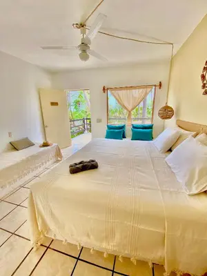 Cama o camas de una habitación en El Eden Escondido