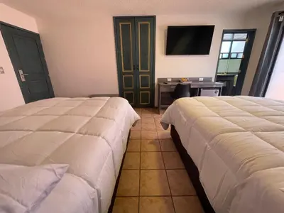 Cama o camas de una habitación en Hotel Casa Real Cholula