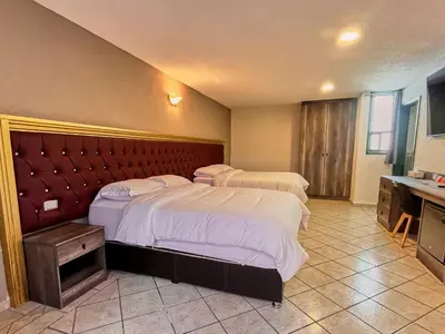 Cama o camas de una habitación en Hotel Casa Real Cholula