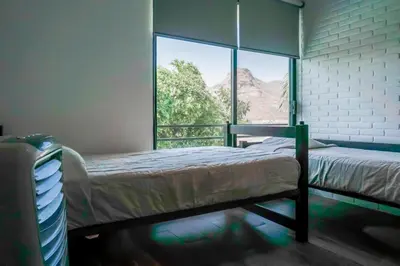 Cama o camas de una habitación en Casa Vista a la Montaña Tlayacapan