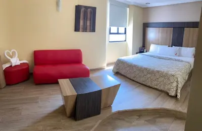 Cama o camas de una habitación en HOTEL M ELITE ROJO