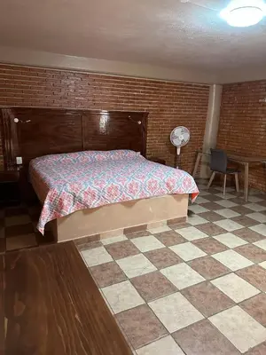 Cama o camas de una habitación en Hotel Villa Del Rey