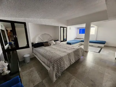 Cama o camas de una habitación en Secretos del Sol Acapulco villas a 5 minutosdel mar