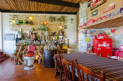 El salón o zona de bar de Hotel Boutique El Rincón