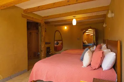 Cama o camas de una habitación en El EQUIMITE HOTEL BOUTIQUE