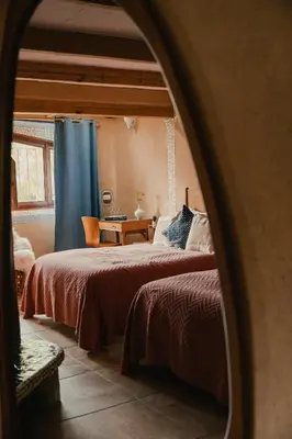 Cama o camas de una habitación en El EQUIMITE HOTEL BOUTIQUE