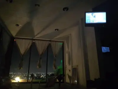 Una televisión o centro de entretenimiento en Loft en Tercer Piso con Vista Panoramica