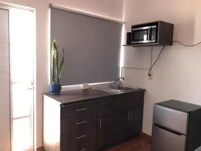 Una cocina o zona de cocina en Departamento Zeus 12