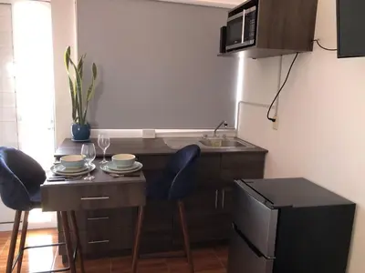 Una cocina o zona de cocina en Departamento Zeus 12